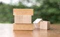 Blank wooden blocks on blurred nature background. Wooden cubes mockup, empty wooden blocks with copy space, wood cubes for new
