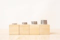 Cubes with stacks of coins on table as money savings concept Royalty Free Stock Photo