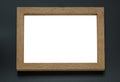 Blank wooden photo frame on black background Royalty Free Stock Photo