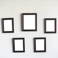 Blank wooden photo frames on the wall Royalty Free Stock Photo