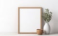 Blank wooden picture frame mockup on off white wall in modern interior. Vertical artwork template mock up for artwork, painting, Royalty Free Stock Photo