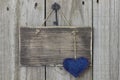 Blank wooden sign with blue calico heart Royalty Free Stock Photo