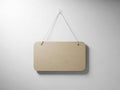 Blank wooden sign hanging on a wall with white string Royalty Free Stock Photo