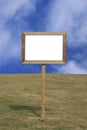 Blank wooden sign post on grass Royalty Free Stock Photo
