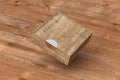 Blank wooden square box with closed sliding lid flying over background Royalty Free Stock Photo