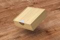 Blank wooden square box with closed sliding lid flying over background Royalty Free Stock Photo