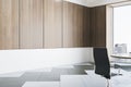 Blank wooden wall in empty conference room with office desk, chairs and window, mockup. 3D Rendering Royalty Free Stock Photo