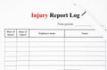 The blank Workplace Injury Report Log with pen
