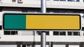 Blank yellow and green reflective road sign in the street