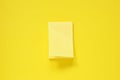 blank yellow note pad stick on vivid yellow paper for background Royalty Free Stock Photo