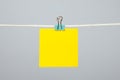 Blank yellow paper note on the string Royalty Free Stock Photo