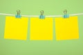Blank yellow paper notes on clothesline Royalty Free Stock Photo