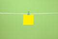 Blank yellow paper sheet on the string Royalty Free Stock Photo