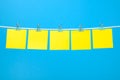 Blank yellow paper sheets on the string Royalty Free Stock Photo