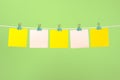 Blank yellow and pink paper notes on the string Royalty Free Stock Photo