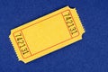 Blank yellow raffle ticket on a blue background Royalty Free Stock Photo