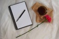 A blank yellow sheet of notepad for notes with green flowers and red scissors. Royalty Free Stock Photo