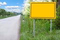 Blank yellow sign along the road for place name Royalty Free Stock Photo