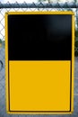 Blank Yellow Sign on Chain-Link Fence