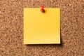 Blank yellow sticky note on the cork board Royalty Free Stock Photo