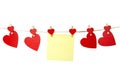 Blank yellow sticky note hanging with red hearts isolated on white background, romantic Valentines Day concept, copy space Royalty Free Stock Photo