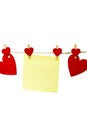 Blank yellow sticky note hanging with red hearts isolated on white background, romantic Valentines Day concept, copy space Royalty Free Stock Photo