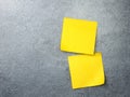 Blank yellow sticky note on texture background. Post it on wall Royalty Free Stock Photo