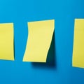 Blank Yellow Sticky Notes on Blue Wall Royalty Free Stock Photo