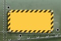 Blank yellow warning metal plate. Steel background with barbed wire Royalty Free Stock Photo