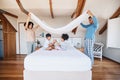 Blanket, fort and children on bed with parents for fun, play or hand game in their home. Bedroom, cover and kids with Royalty Free Stock Photo