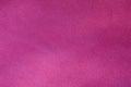 The blanket of furry pink fleece fabric. A background texture of light pink soft plush fleece materia