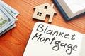 Blanket mortgage written phrase and model of home