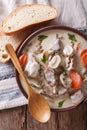 Blanquette de veau close up in a bowl. Vertical top view Royalty Free Stock Photo