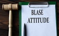 BLASE ATTITUDE - words on a white sheet with a judge\'s gavel Royalty Free Stock Photo