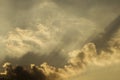 The blasting beam from the clouds in the golden sky at sunset