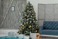 Enchanting Christmas Scene: Full of Decorative Christmas Tree with Blue Gift Boxes, Overflowing with Presents in a Festive Room Royalty Free Stock Photo