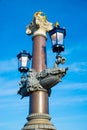 Blauwbrug Blue Bridge in Amsterdam. Columns decorated with lanterns. Royalty Free Stock Photo