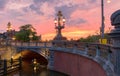 Blauwbrug Blue Bridge over Amstel river in Amsterdam at sunset spring evening, Holland.