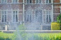 Blauwendael Castle in the East Flemish town of Waasmunster, Belgium. Fountain spray
