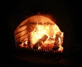 Blazing fireplace in the evening time Royalty Free Stock Photo