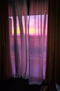 Blazing Sunset Beams Through Hotel Room Balcony