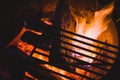 Blazing Wood Fire in an Open Pit with Grill above Royalty Free Stock Photo