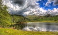 Blea Tarn between Great Langdale and Little Langdale Lake District Cumbria UK in colourful HDR Royalty Free Stock Photo