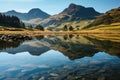 Blea Tarn in the Lake District National Park, with the Langdale Pike\'s reflected in the perfectly still waters on a stunning