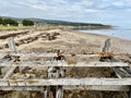 Bleached wooden fence on beach in the Scottish Highlands. Golspie, Scotland. Royalty Free Stock Photo