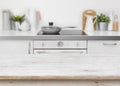 Bleached wooden texture table on defocused kitchen bench interior background Royalty Free Stock Photo