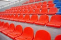 Bleachers in a sports stadium. Red and blue seats in a large street stadium. Royalty Free Stock Photo