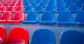 Bleachers in a sports stadium. Red and blue seats in a large street stadium. Royalty Free Stock Photo