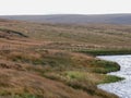 The edge of Brun Clough reservoir in the pennines with moorland