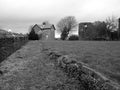 Bleak monotone welsh landscape with castle Royalty Free Stock Photo